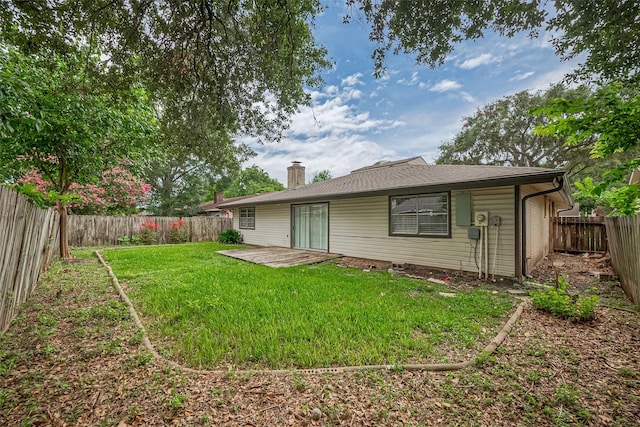 10423 Rancho Bernardo Ln, Sugar Land, TX 77498 - rear view of property with a chimney, a fenced backyard, and a patio area