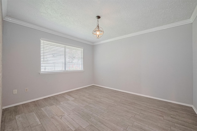 10423 Rancho Bernardo Ln, Sugar Land, TX 77498 - unfurnished room featuring a textured ceiling, wood finished floors, a chandelier, and ornamental molding