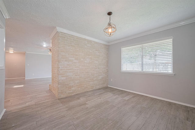 10423 Rancho Bernardo Ln, Sugar Land, TX 77498 - unfurnished room featuring a textured ceiling, wood finished floors, ornamental molding, and a ceiling fan