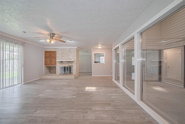 10423 Rancho Bernardo Ln, Sugar Land, TX 77498 - unfurnished living room featuring a ceiling fan, a textured ceiling, a fireplace, and light wood-style flooring