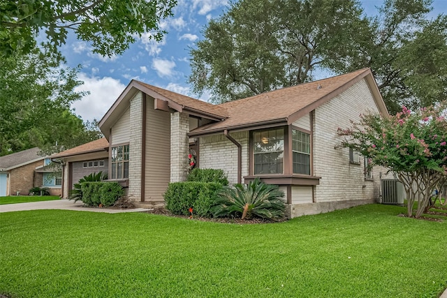 9302 Moorfield Ct, Houston, TX 77083 - mid-century home featuring brick siding, a garage, a front yard, and driveway