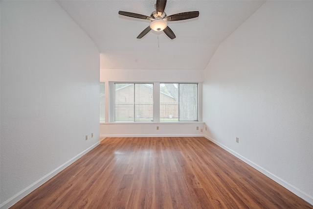 9302 Moorfield Ct, Houston, TX 77083 - empty room with wood finished floors, a ceiling fan, and vaulted ceiling
