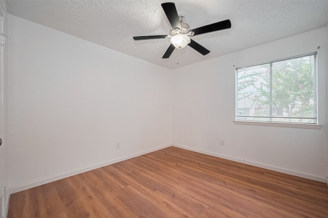 9302 Moorfield Ct, Houston, TX 77083 - empty room featuring light wood-style flooring, a textured ceiling, and ceiling fan
