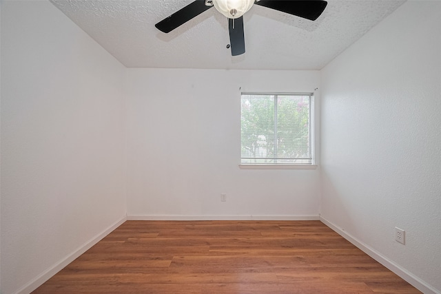 9302 Moorfield Ct, Houston, TX 77083 - empty room featuring wood finished floors, ceiling fan, and a textured ceiling