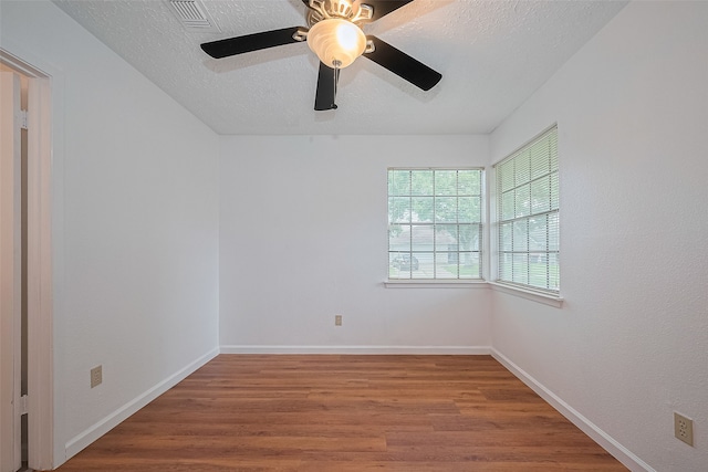 9302 Moorfield Ct, Houston, TX 77083 - unfurnished room with wood finished floors, a textured ceiling, and ceiling fan