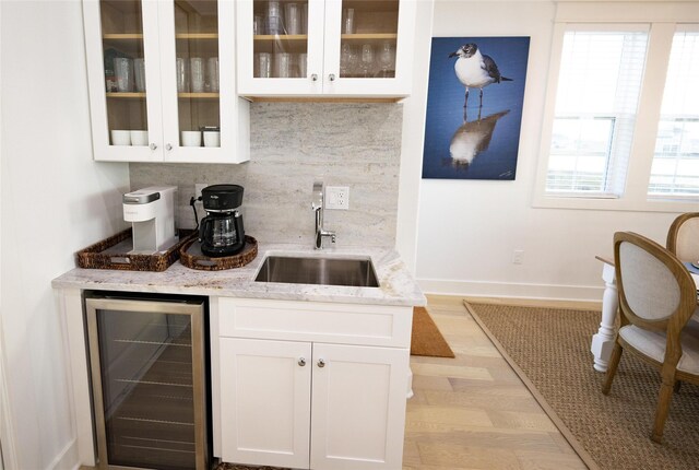 18414 Indian Beach Ct, Galveston, TX 77554 - bar featuring wine cooler and backsplash