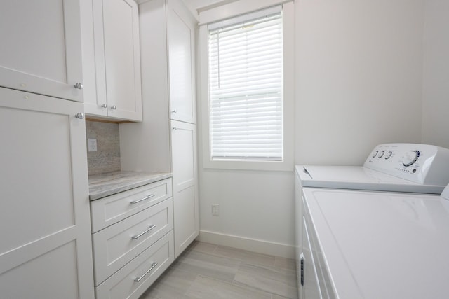 18414 Indian Beach Ct, Galveston, TX 77554 - washroom featuring separate washer and dryer and cabinet space