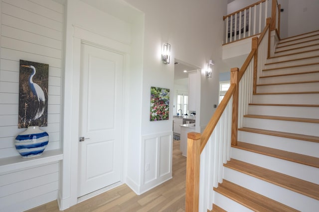 18414 Indian Beach Ct, Galveston, TX 77554 - staircase with wood finished floors