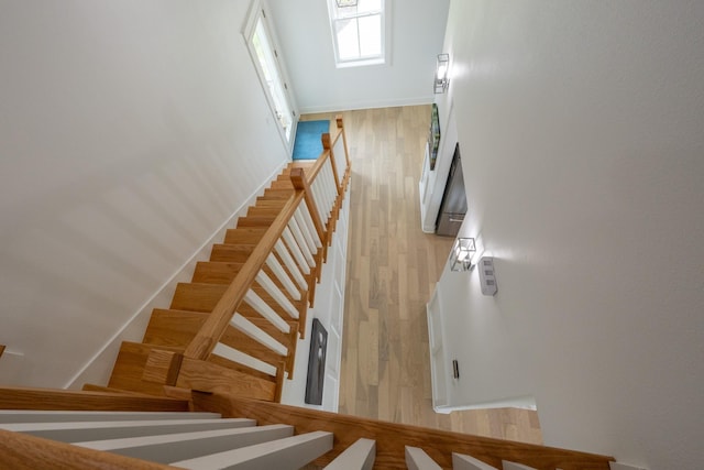 18414 Indian Beach Ct, Galveston, TX 77554 - stairs with wood finished floors