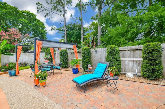 15915 Sweetwater Creek Dr, Houston, TX 77095 - fenced backyard featuring a gazebo, a patio, and outdoor dining area