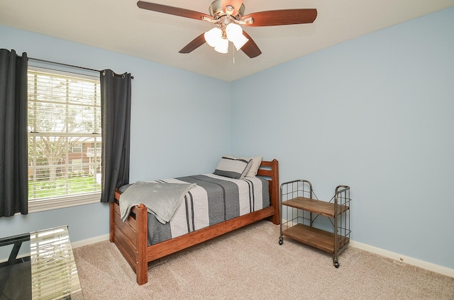 15915 Sweetwater Creek Dr, Houston, TX 77095 - carpeted bedroom with baseboards and a ceiling fan