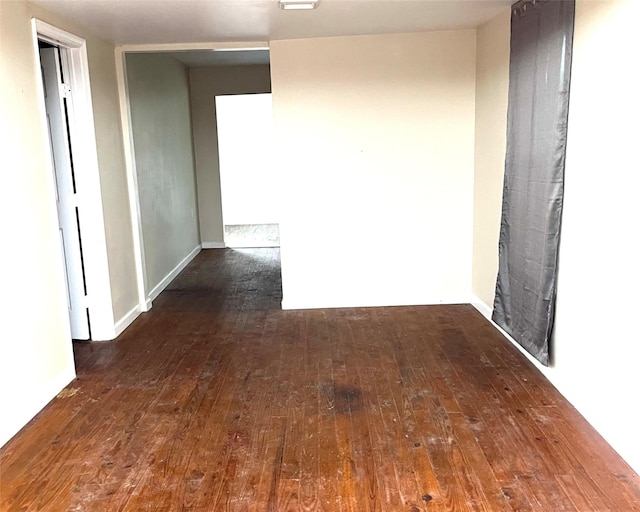 3707 12th St, Brookshire, TX 77423 - hallway featuring dark wood-style flooring and baseboards