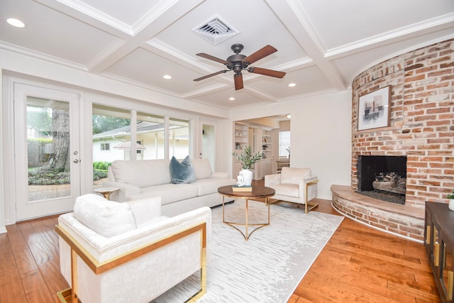 10035 Ella Lee Ln, Houston, TX 77042 - living room with a ceiling fan, coffered ceiling, hardwood / wood-style flooring, a brick fireplace, and beam ceiling
