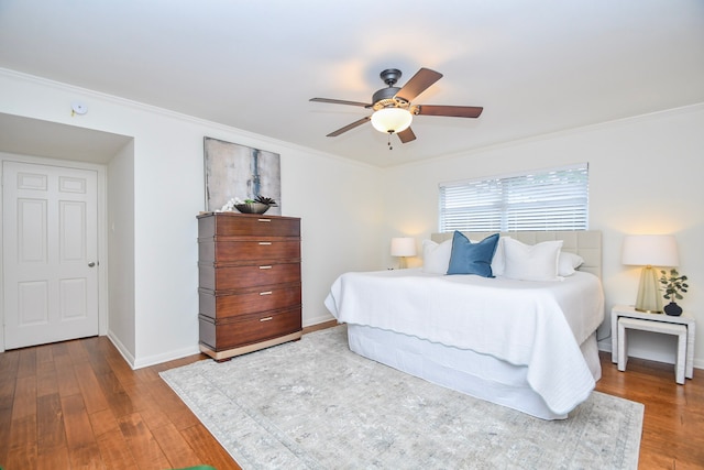 10035 Ella Lee Ln, Houston, TX 77042 - bedroom with wood finished floors, crown molding, and ceiling fan