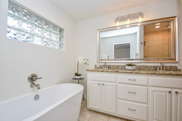 10035 Ella Lee Ln, Houston, TX 77042 - full bathroom with a freestanding bath, double vanity, and tile patterned flooring