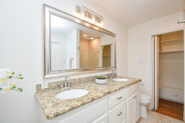 10035 Ella Lee Ln, Houston, TX 77042 - bathroom featuring double vanity, tile patterned flooring, and a shower