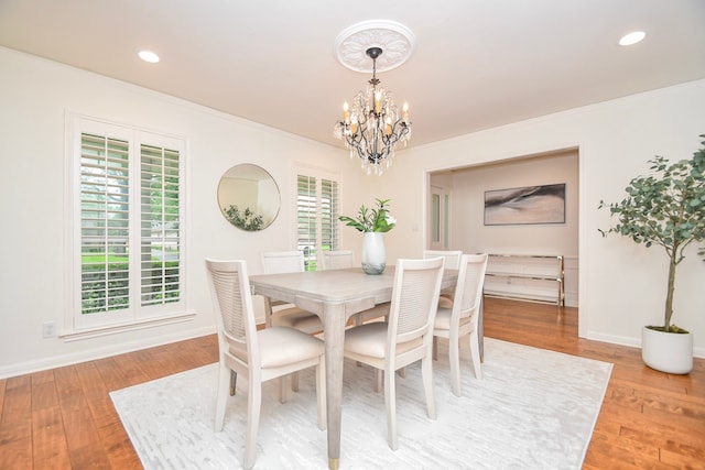10035 Ella Lee Ln, Houston, TX 77042 - dining room with a chandelier, ornamental molding, light wood finished floors, and recessed lighting