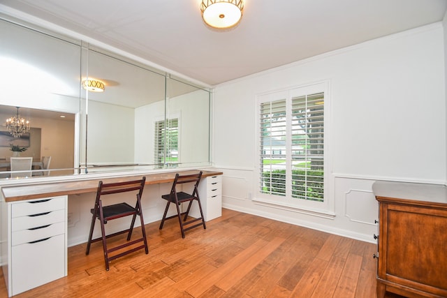 10035 Ella Lee Ln, Houston, TX 77042 - office with light wood-style flooring, healthy amount of natural light, ornamental molding, and a chandelier