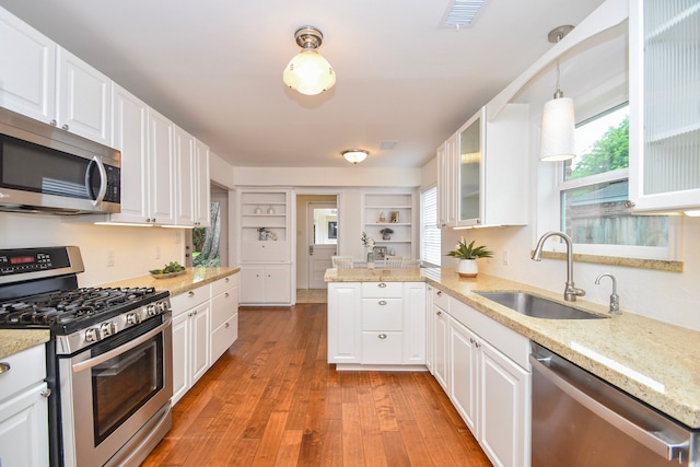 10035 Ella Lee Ln, Houston, TX 77042 - kitchen with appliances with stainless steel finishes and white cabinetry