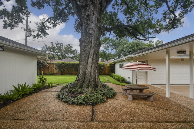 10035 Ella Lee Ln, Houston, TX 77042 - view of yard featuring concrete driveway and an attached garage