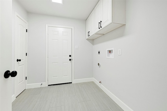 10019 Braes Forest Dr, Houston, TX 77071 - laundry room with cabinet space, hookup for a washing machine, hookup for an electric dryer, and light floors