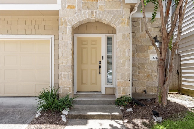 3324 Masters Point Dr, Houston, TX 77091 - entrance to property with a garage and stone siding