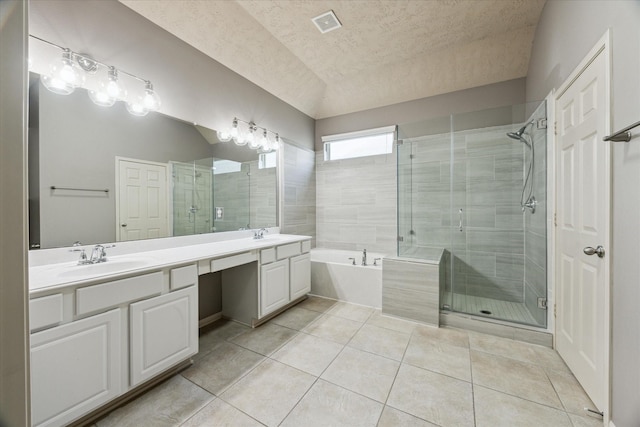 3324 Masters Point Dr, Houston, TX 77091 - full bath with double vanity, tile patterned flooring, a bath, a shower stall, and a textured ceiling
