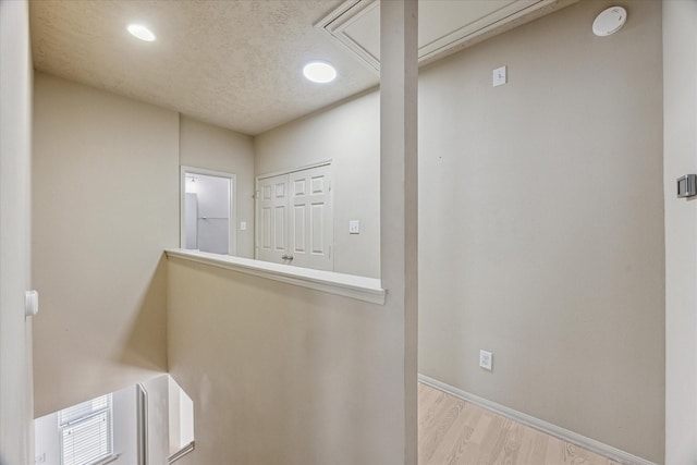 3324 Masters Point Dr, Houston, TX 77091 - corridor with attic access, wood finished floors, and recessed lighting