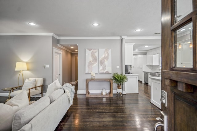 829 E 27th St, Houston, TX 77009 - living room featuring ornamental molding, dark wood-style floors, and recessed lighting