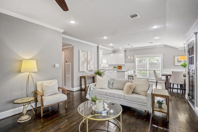 829 E 27th St, Houston, TX 77009 - living room with ornamental molding, dark wood finished floors, and recessed lighting