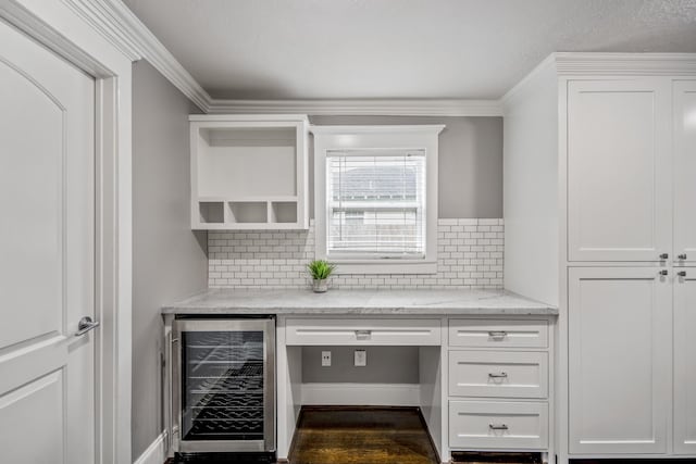 829 E 27th St, Houston, TX 77009 - home office featuring beverage cooler, wood finished floors, and crown molding