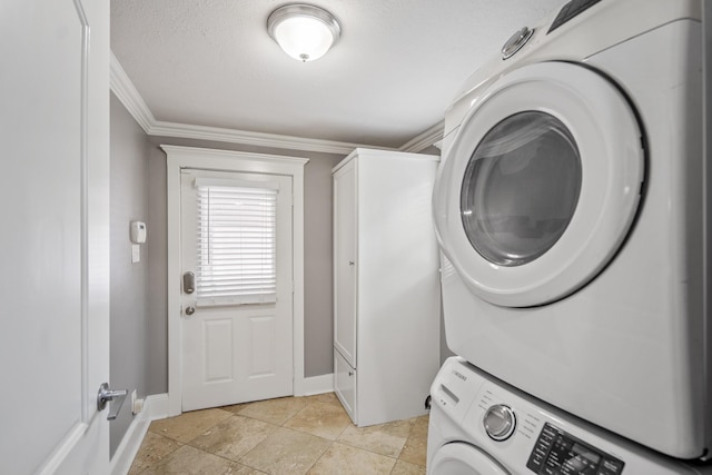829 E 27th St, Houston, TX 77009 - laundry room with stacked washing machine and dryer, cabinet space, and crown molding