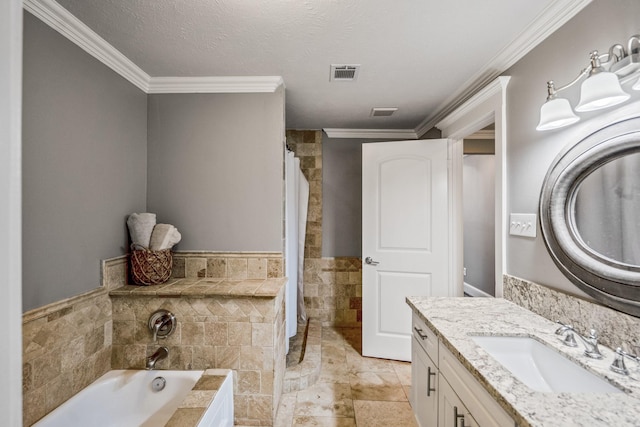 829 E 27th St, Houston, TX 77009 - full bath featuring vanity, a bath, ornamental molding, and tile walls