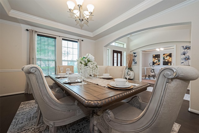 6022 Allendale Ridge Trl, Richmond, TX 77407 - dining room featuring a chandelier, arched walkways, dark wood-style floors, and ornamental molding