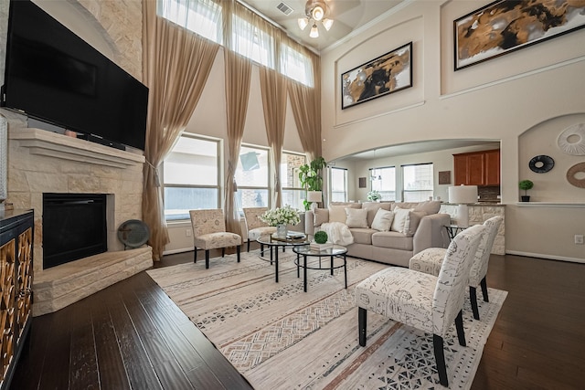 6022 Allendale Ridge Trl, Richmond, TX 77407 - living room with wood-type flooring, ceiling fan, plenty of natural light, a fireplace, and a high ceiling