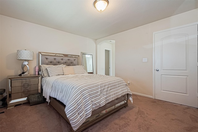 6022 Allendale Ridge Trl, Richmond, TX 77407 - carpeted bedroom featuring arched walkways and baseboards