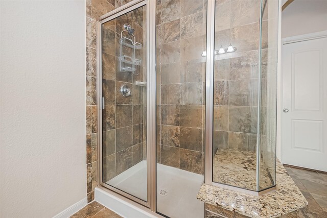 6022 Allendale Ridge Trl, Richmond, TX 77407 - full bathroom with a stall shower and baseboards