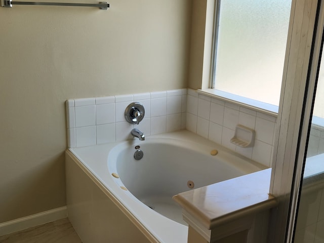 19843 Portlick Ct, Katy, TX 77449 - full bathroom with a jetted tub and baseboards