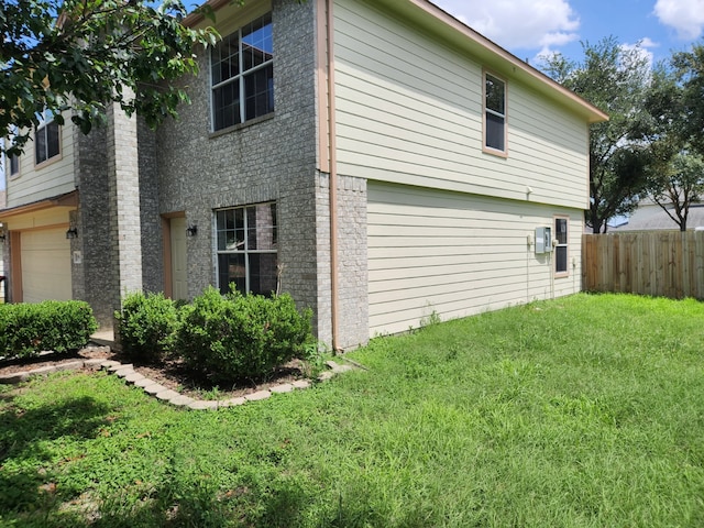 19843 Portlick Ct, Katy, TX 77449 - view of home's exterior with an attached garage and brick siding