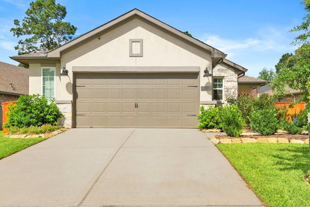 247 N Wild Petunia Trl, Montgomery, TX 77316 - single story home featuring stone siding, an attached garage, stucco siding, and driveway