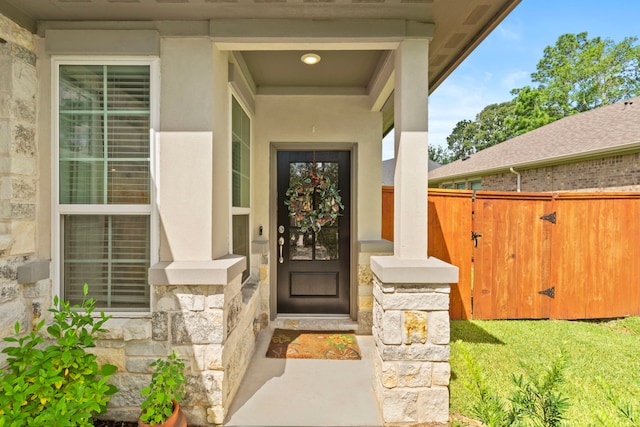 247 N Wild Petunia Trl, Montgomery, TX 77316 - doorway to property featuring stone siding and a gate