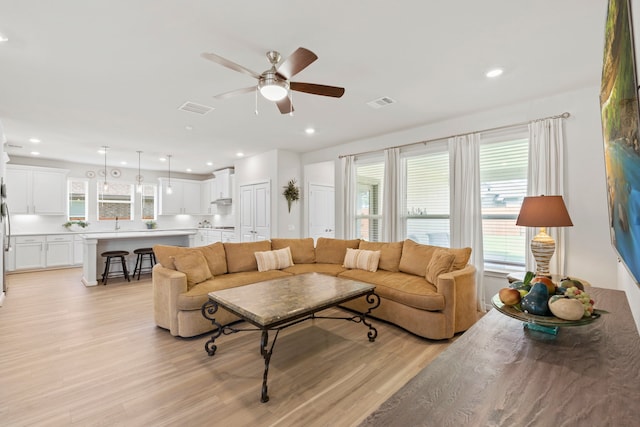 247 N Wild Petunia Trl, Montgomery, TX 77316 - living area with light wood finished floors, ceiling fan, and recessed lighting