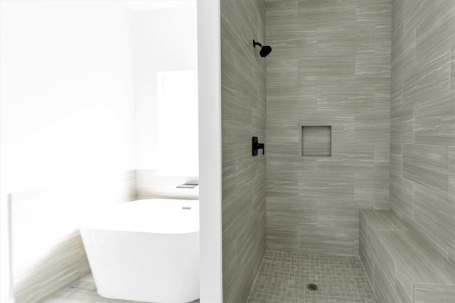 1005 Lake View Dr, Montgomery, TX 77356 - bathroom featuring a freestanding bath, tiled shower, and tile patterned floors