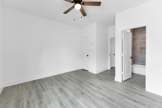 1005 Lake View Dr, Montgomery, TX 77356 - unfurnished bedroom featuring light wood-type flooring, ensuite bathroom, and ceiling fan