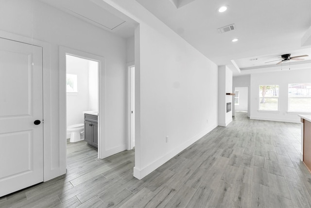 1005 Lake View Dr, Montgomery, TX 77356 - unfurnished room featuring light wood-style floors, a ceiling fan, recessed lighting, and a tray ceiling