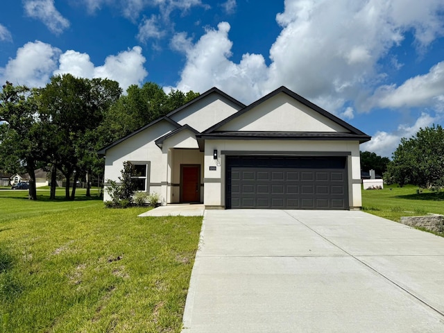 1005 Lake View Dr, Montgomery, TX 77356 - single story home with an attached garage, a front lawn, driveway, and stucco siding