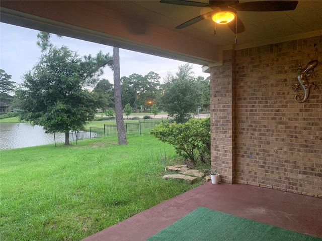 3614 Bonnie Bend Ln, Katy, TX 77494 - view of yard featuring a ceiling fan, a water view, and a patio area