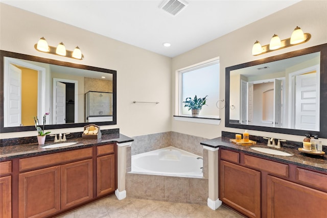 3614 Bonnie Bend Ln, Katy, TX 77494 - full bath featuring two vanities, a garden tub, tile patterned flooring, and a stall shower
