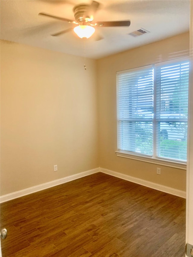 3614 Bonnie Bend Ln, Katy, TX 77494 - empty room featuring dark wood-style flooring and a ceiling fan