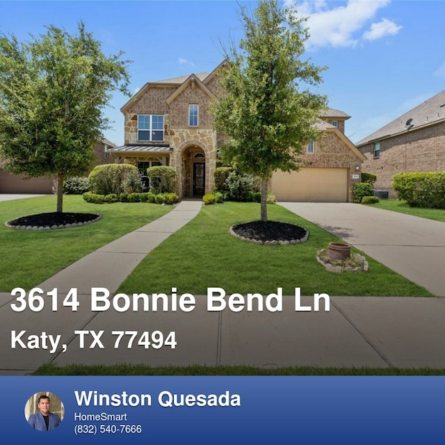 3614 Bonnie Bend Ln, Katy, TX 77494 - traditional home with stone siding, driveway, a garage, and a front lawn